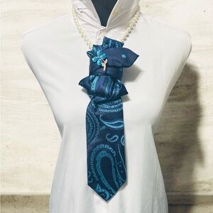 Elegant Blue Paisley Necktie with Flower Brooch